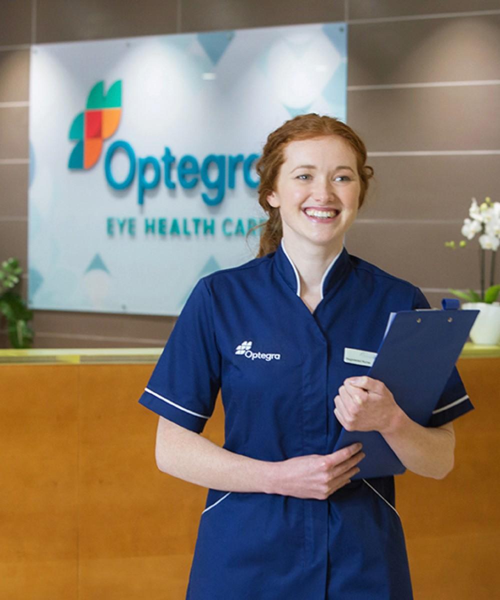 A nurse walking through reception in an Optegra hospital