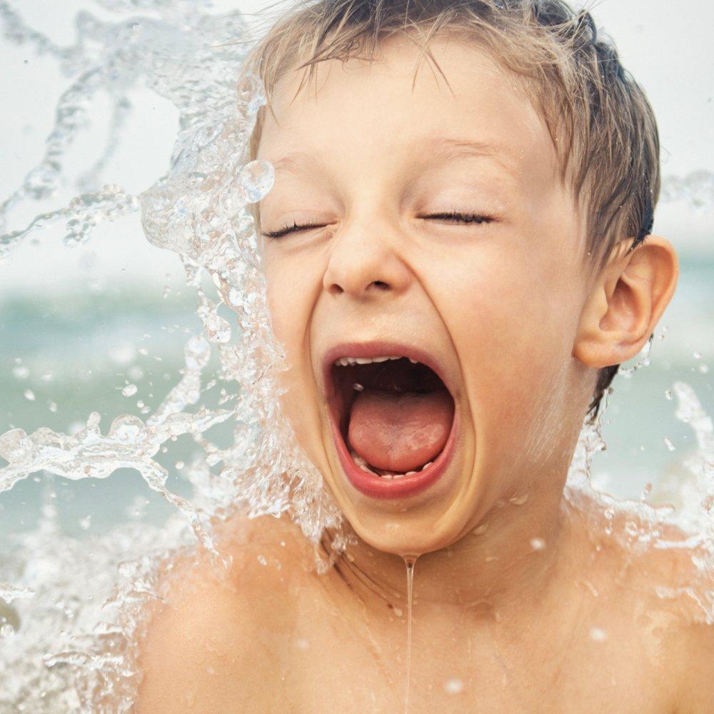 A photo of a child swimming, representing with with Optegra