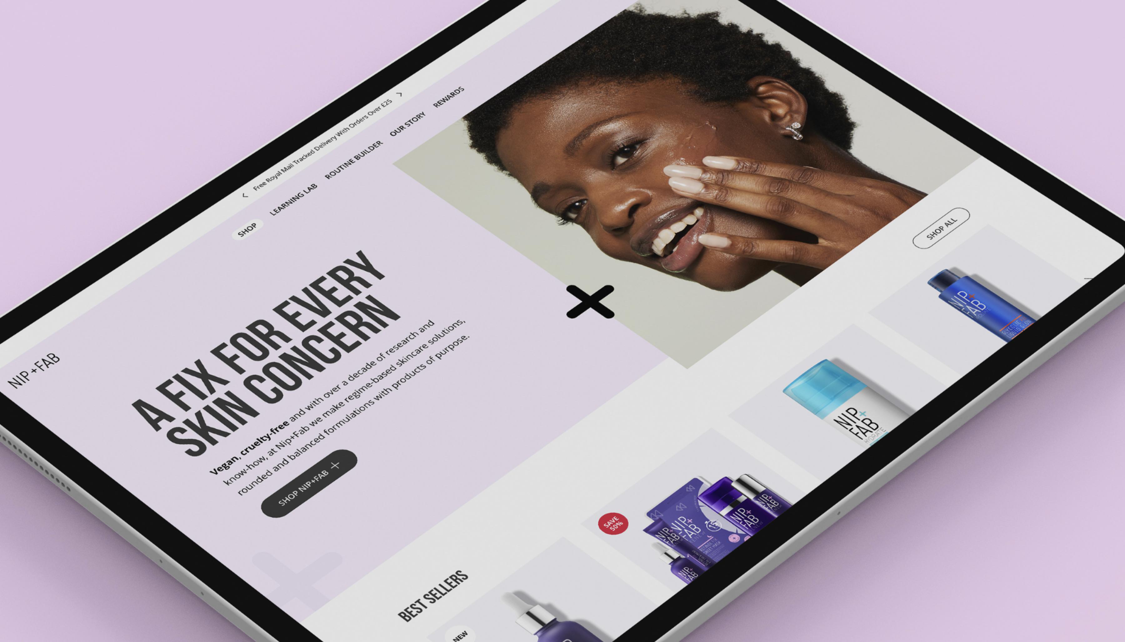 Nip + Fab site on a tablet. Features a close up shot of a black woman applying a facial serum