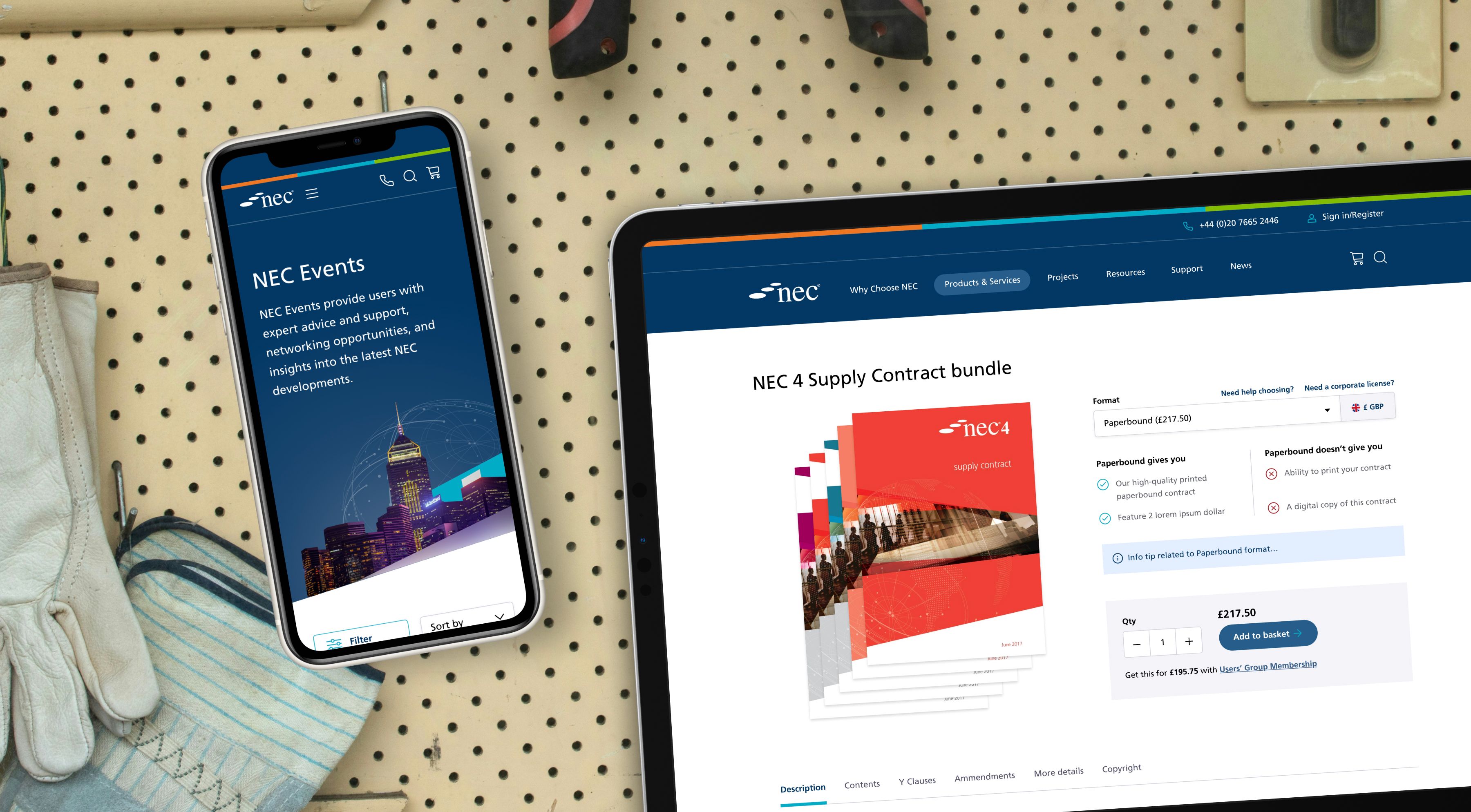 A wall with tools hanging on it, which also has a mobile and tablet device showing website examples