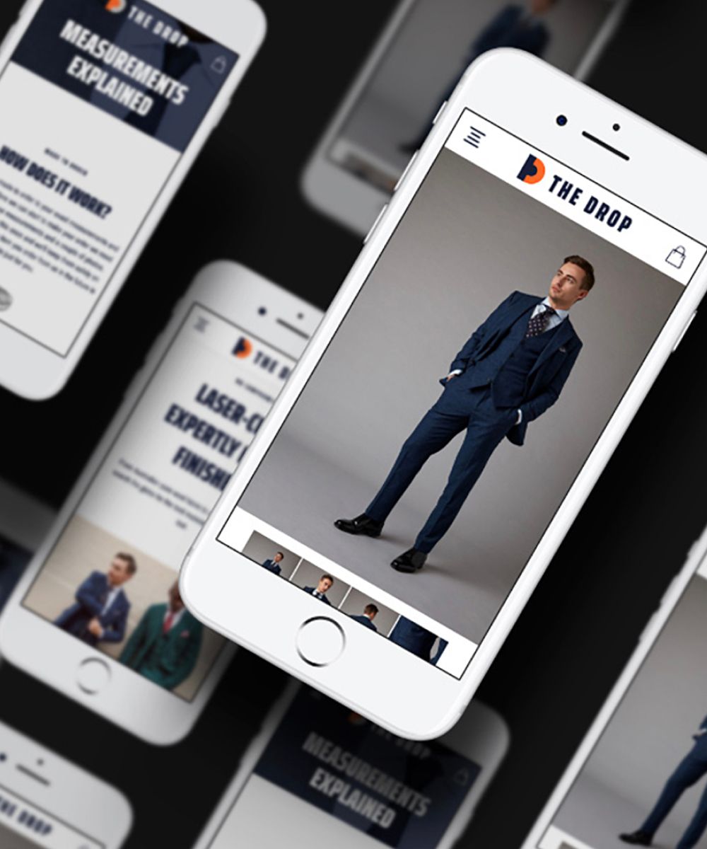 An image of multiple mobile devices showing the site, with a man in a grey suit showing prominently